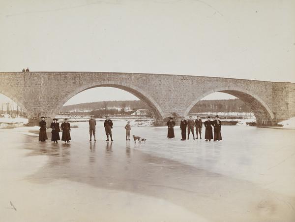 Members of the Aberdeen public walk on the frozen River Dee in the early 1900s.