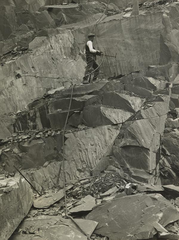 A slate worker carries out dangerous work at Ballachulish.