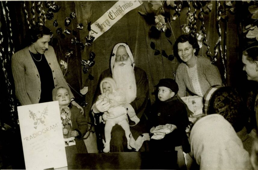 Children get the chance to go to Santa's Grotto at the store back in 1949.