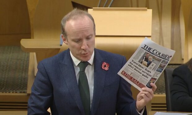Michael Marra raising the breast cancer scandal at Holyrood.