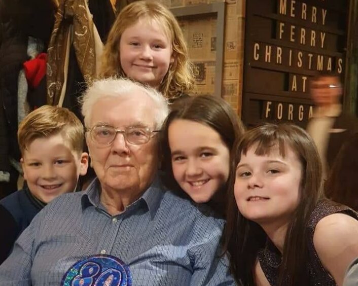 Mr Wood on his 80th birthday with his youngest grandchildren, Chelsea, Ellie, Maisie and Zac.