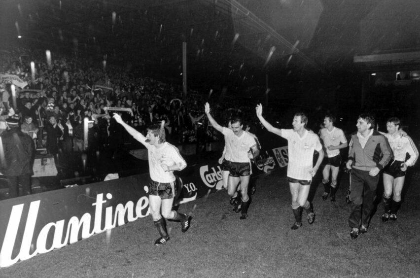 The players embark on a lap of honour after beating Hamburg.