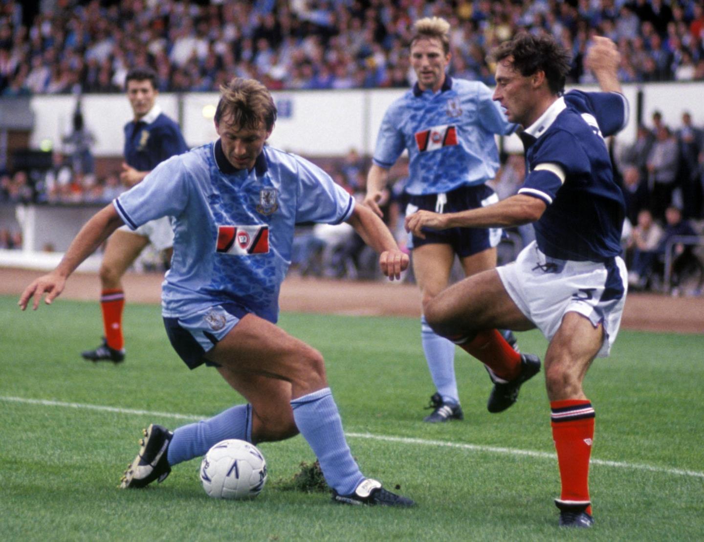Istvan Kozma, left, is challenged by Scotland's Maurice Malpas in the 1990 match.