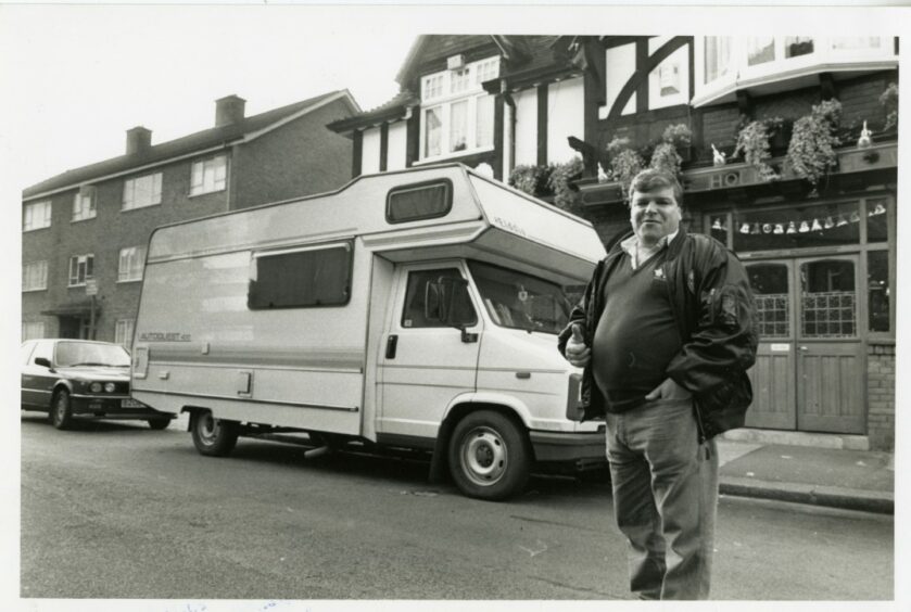 Darts player Jocky Wilson poses with his campervan in 1990. Picture: DCT Media.