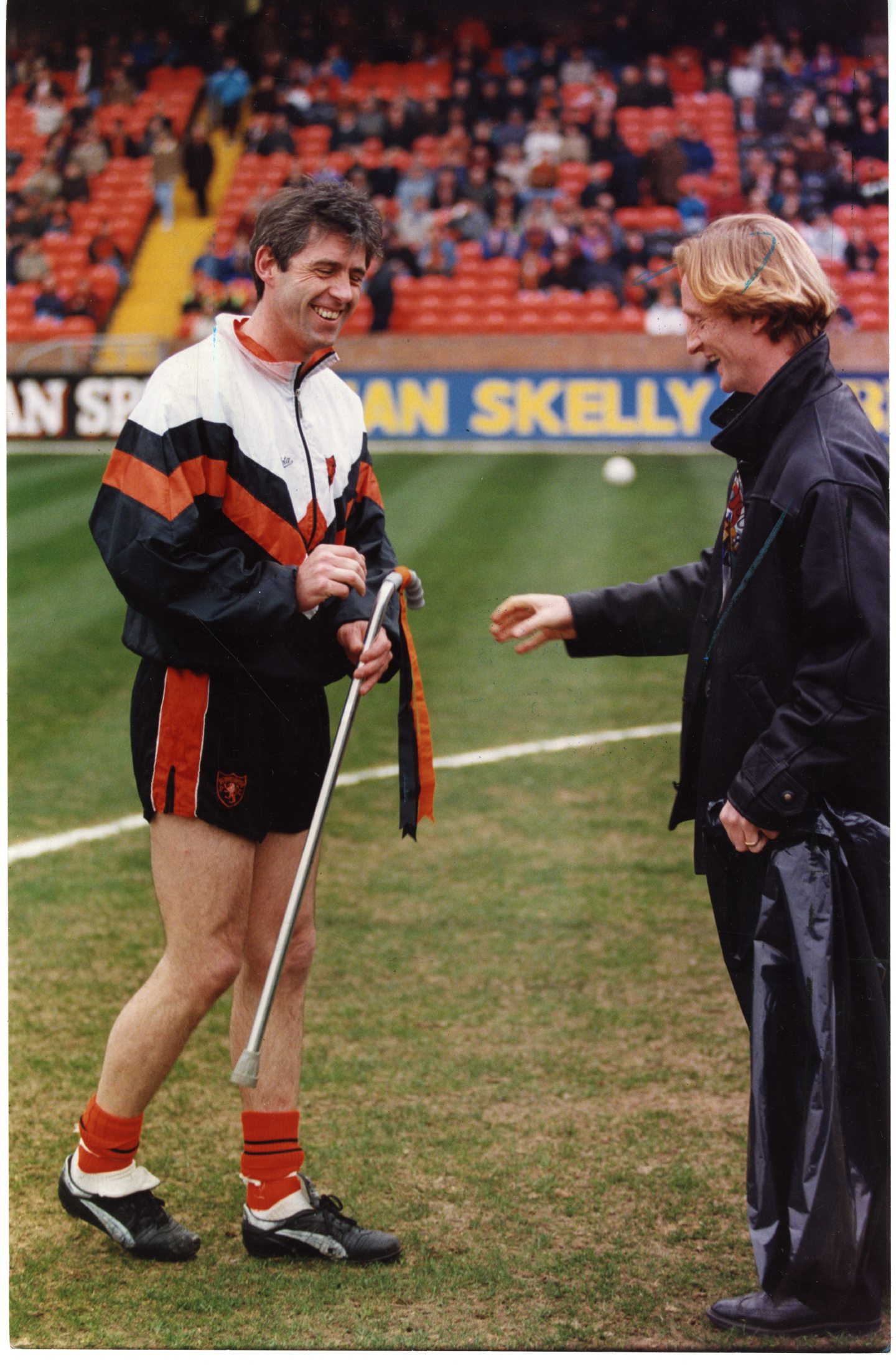 Narey is given a walking stick from team-mate Dave Bowman in 1993 after marking another career milestone.