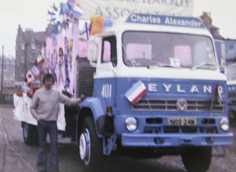 Doug McConochie and the Charles Alexander truck he drove in an Aberdeen parade in the late 70's.