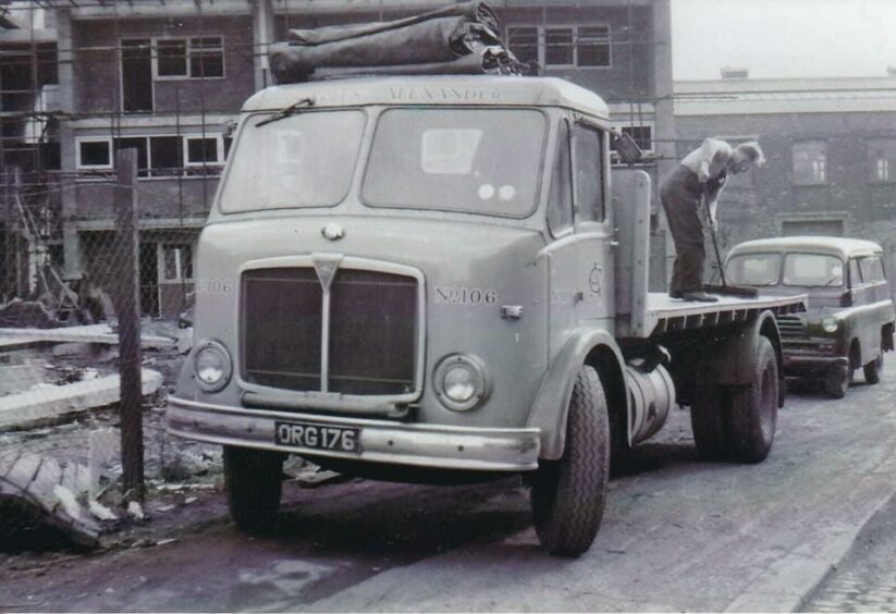 An old Charles Alexander of Aberdeen lorry with worker on flatbed.  Supplied by Roger Auldhouse via Facebook