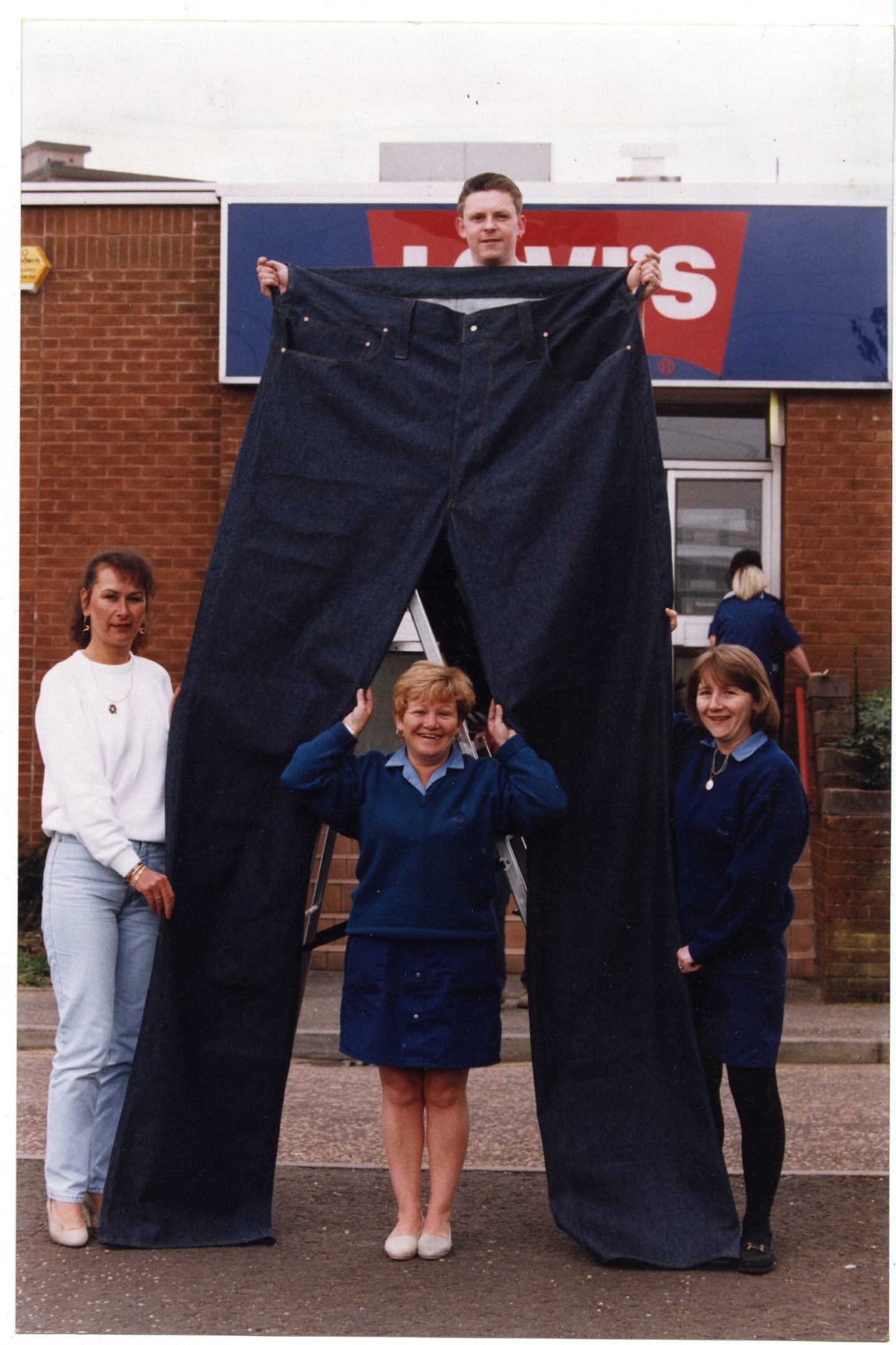 Dundee Levi's workers outside the site with a giant pair of jeans