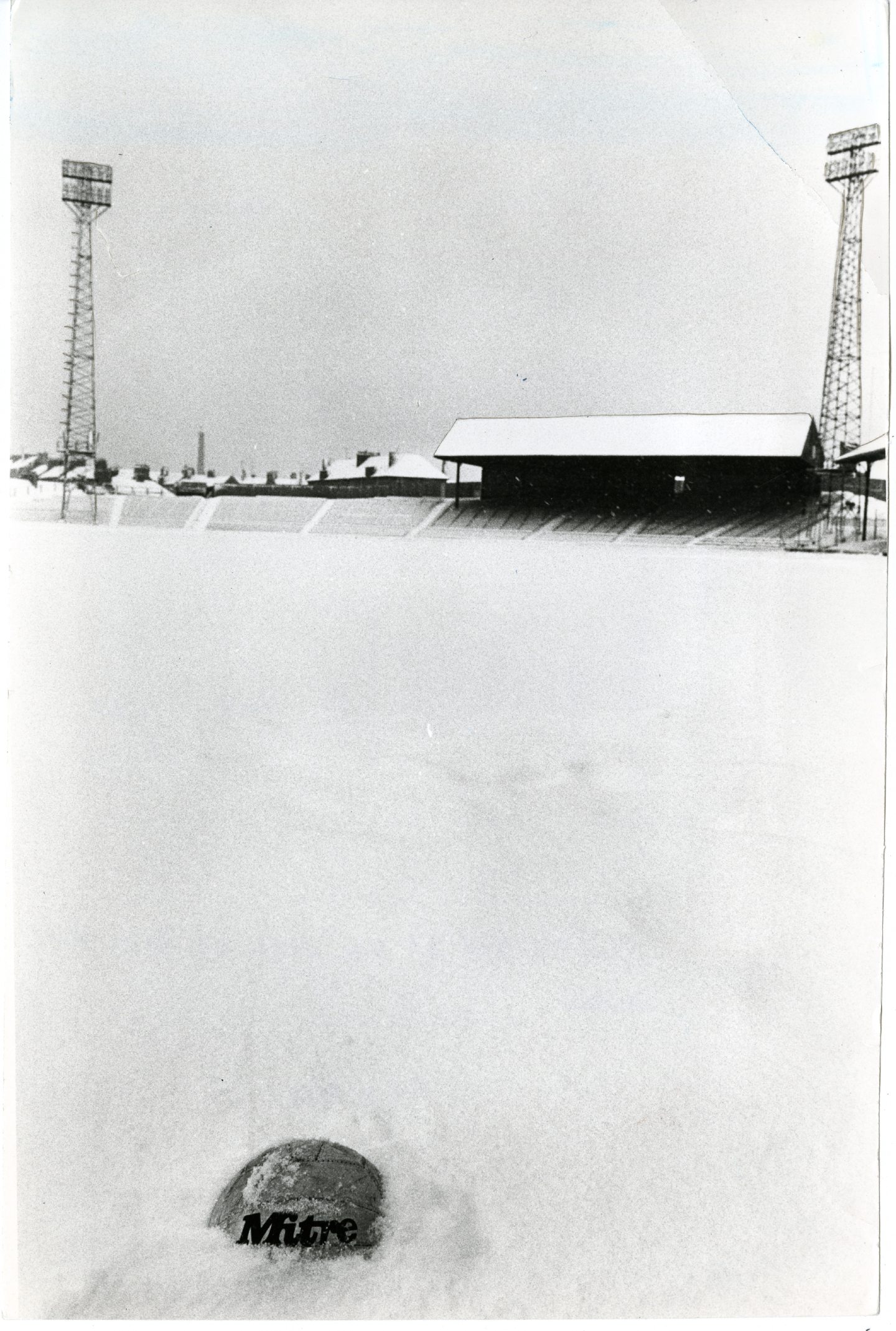A football submerged in snow at Dens Park during the winter conditions which struck the region. Picture: DCT Media.
