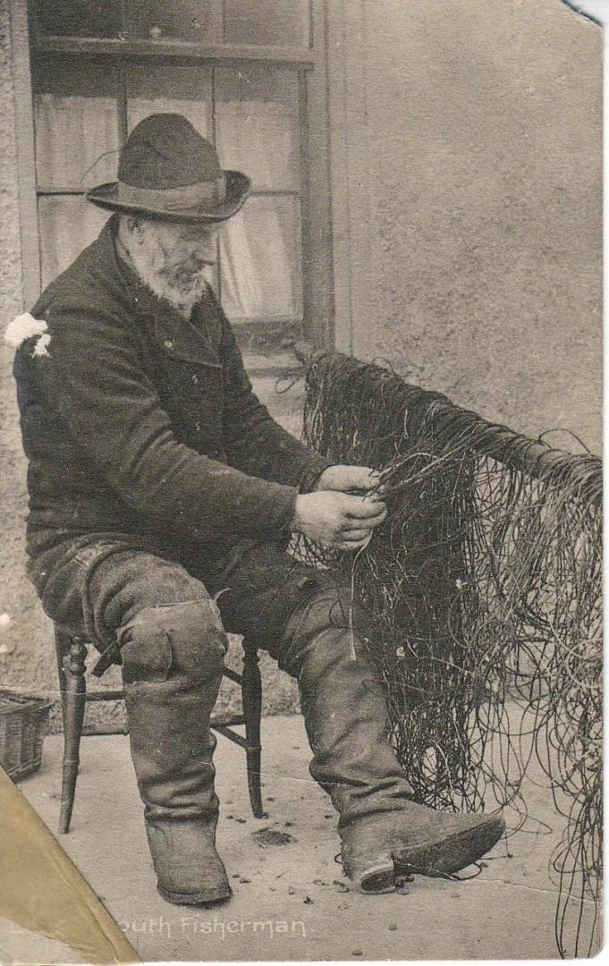 An old fisherman tends to his nets in Lossiemouth.