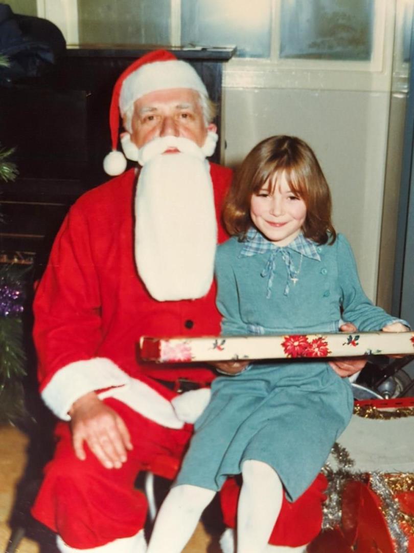 Michelle with Santa during a DC Thomson Christmas party.
