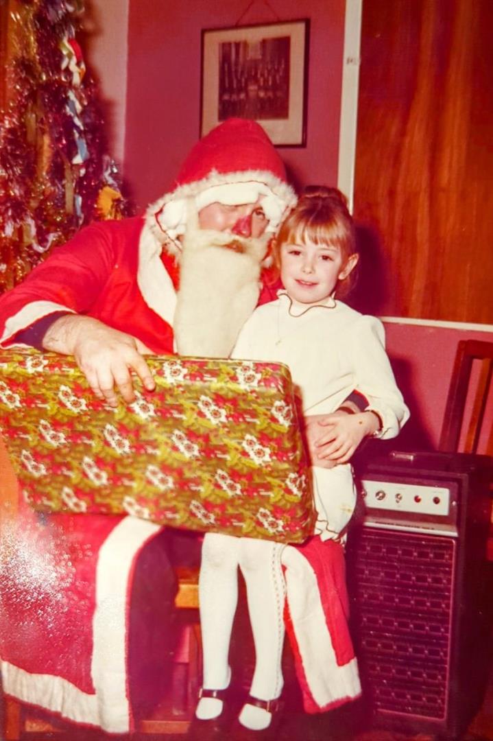 Christmas fun: Michelle with Father Christmas as a child.