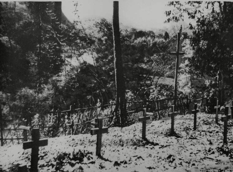 A cemetery near the Bangkok-Moulmein Railway cleared by Japanese labourers. Thousands of British and Allied prisoners died in the building of the railway. Northcliffe Collection.