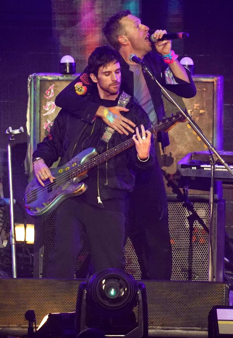 Guy Berryman on stage with Coldplay singer Chris Martin during the band's gig in January in California.