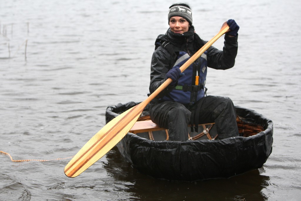 Gayle paddles her coracle.