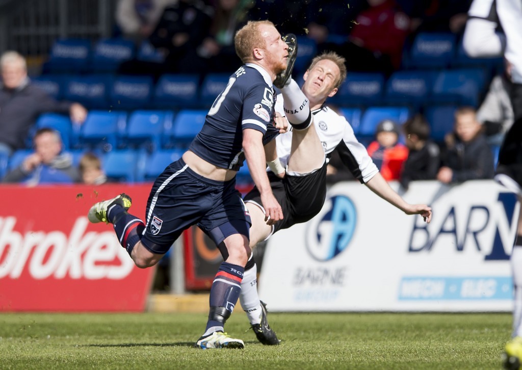 Liam Boyce gets a close-up view of the boot of St Johnstone's Steven Anderson.