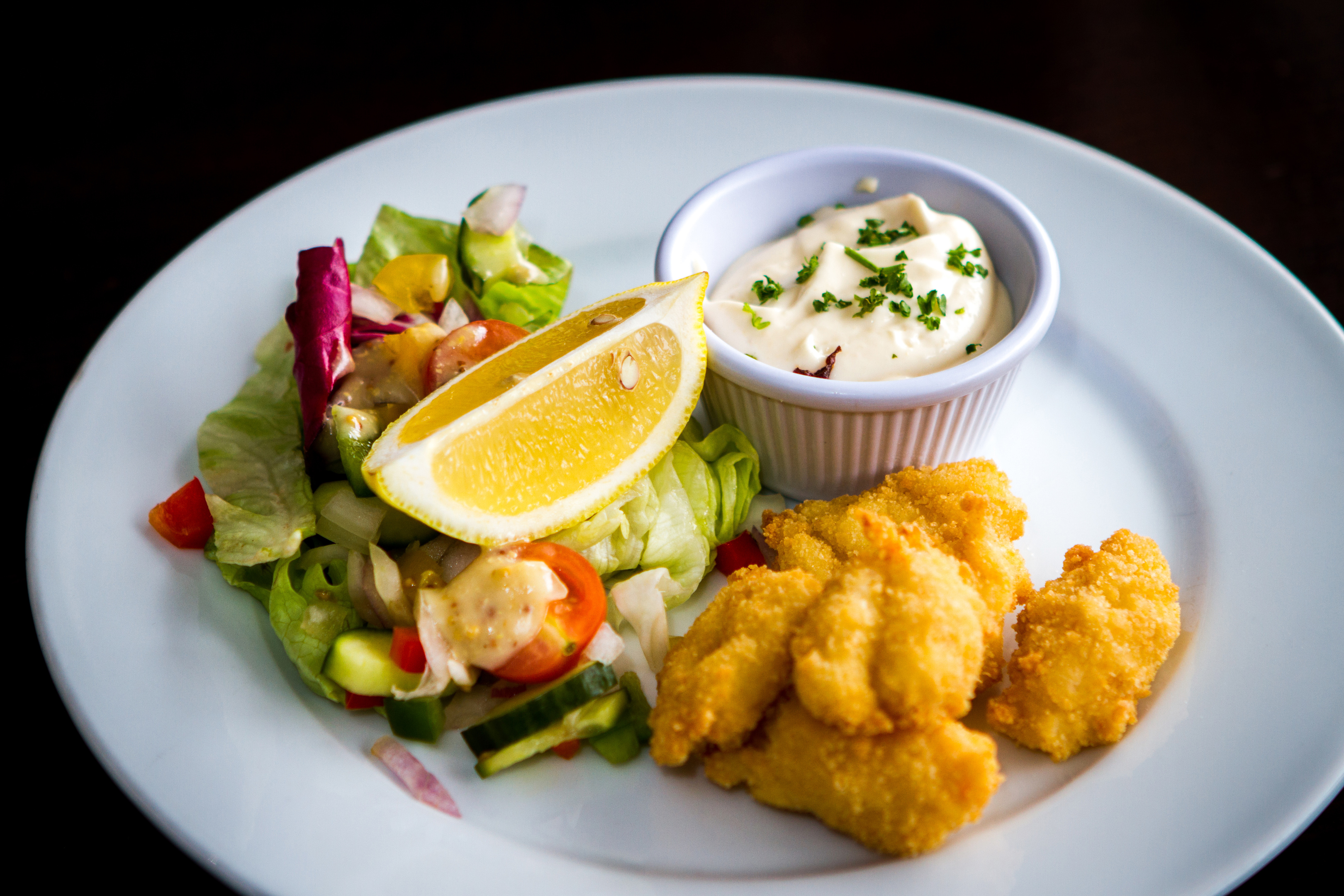 The Alyth Hotel's fresh scampi tails coated in homemade breadcrumbs served with a crisp salad and Aioli.