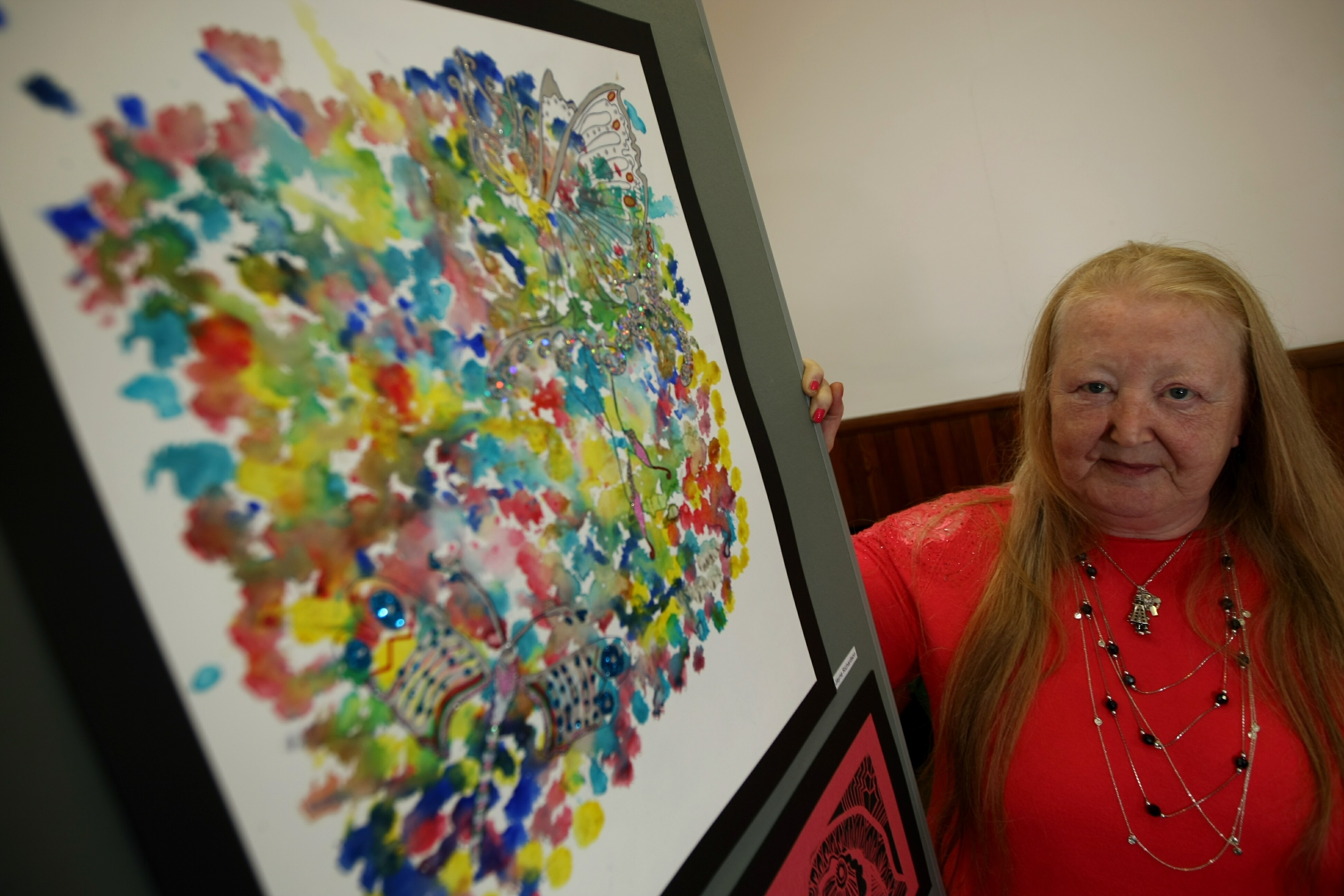 Jayne Richardson, beside her artwork.