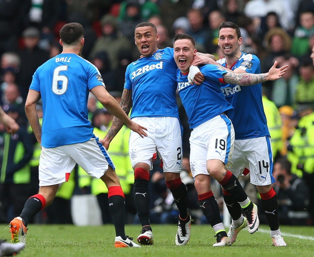 Barrie McKay is mobbed by team-mates after scoring Rangers' second goal.