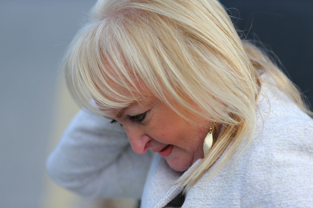 WARRINGTON, ENGLAND - APRIL 26: Jenni Hicks, who lost her two daughters at Hillsborough, arrives at Birchwood Park to hear the conclusions of the Hillsborough inquest on April 26, 2016 in Warrington, England. The fresh inquests into the 1989 Hillsborough disaster, in which 96 football supporters were crushed to death, began on March 31 2014 after the initial verdicts were quashed. Relatives of Liverpool supporters who died in Britain's worst sporting disaster gathered in the purpose-built court to hear the jurys verdict in Warrington after a 25 year fight to overturn the accidental death verdicts handed down at the initial 1991 inquiry. (Photo by Dave Thompson/Getty Images)