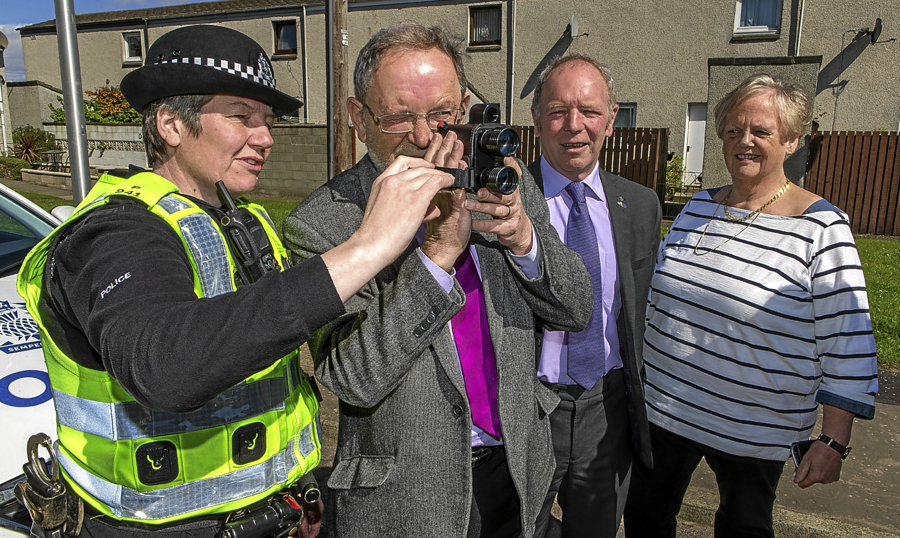 Local Councillors have purchased and donated a new Handheld Laser Speed Meter for Police Scotland to use. The UNIPAR SL700 meter will be in force to keep speeding vehicles in touch locally. PC Susie Martin demonstrates the new camera to Cllr Tim Brett, overlooked by Cllrs Bill Connor and Maggie Taylor