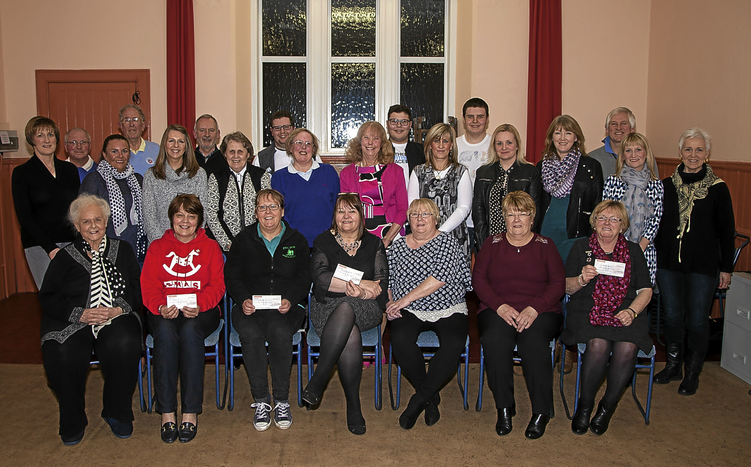 Angus Minstrels with representatives of the recipient charities