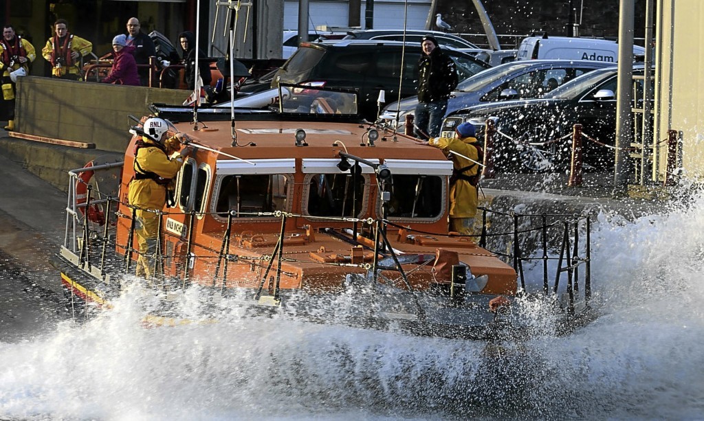 Arbroath all-weather lifeboat Inchcape launches from the station slipway.