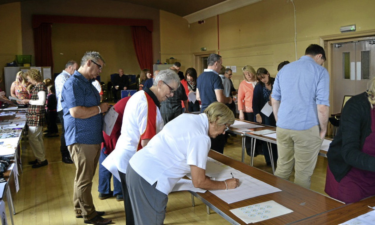 Villagers pour over the plans for Kelty in a previous meeting