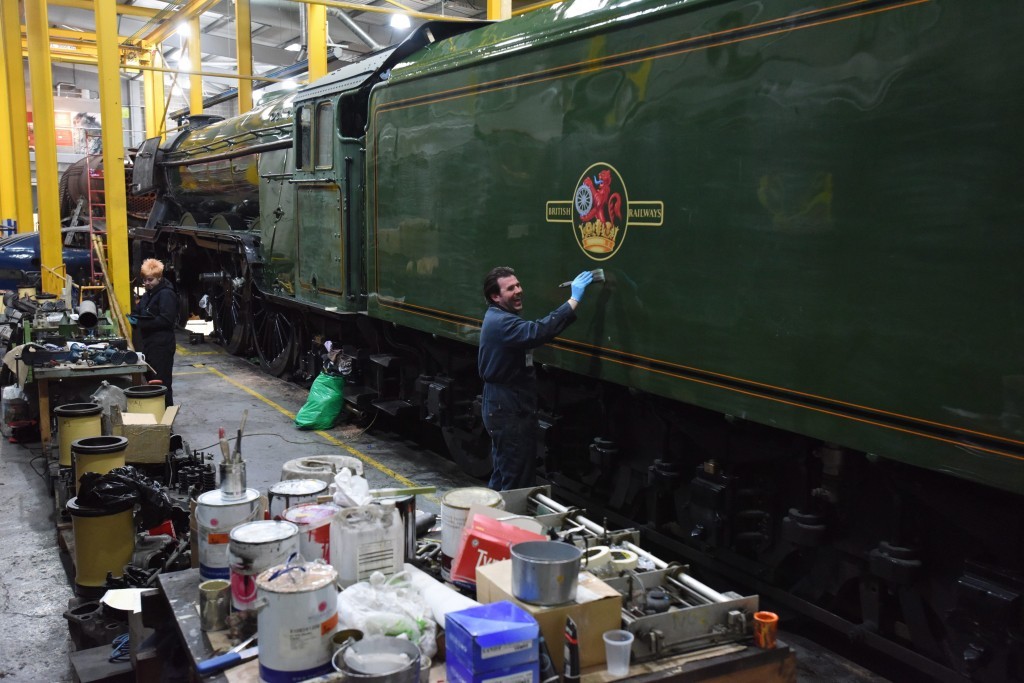 Dated: 17/02/2016 FLYING COLOURS ... The finishing touches are made to the successful completion of a £4.2m ten-year restoration project upon the iconic Flying Scotsman steam locomotive, which saw the numbers 60103 applied to the cab and marked the final stages of its transformation from business-like black to BR green, ready for its inaugural run. See story North News #NorthNewsAndPictures/2daymedia