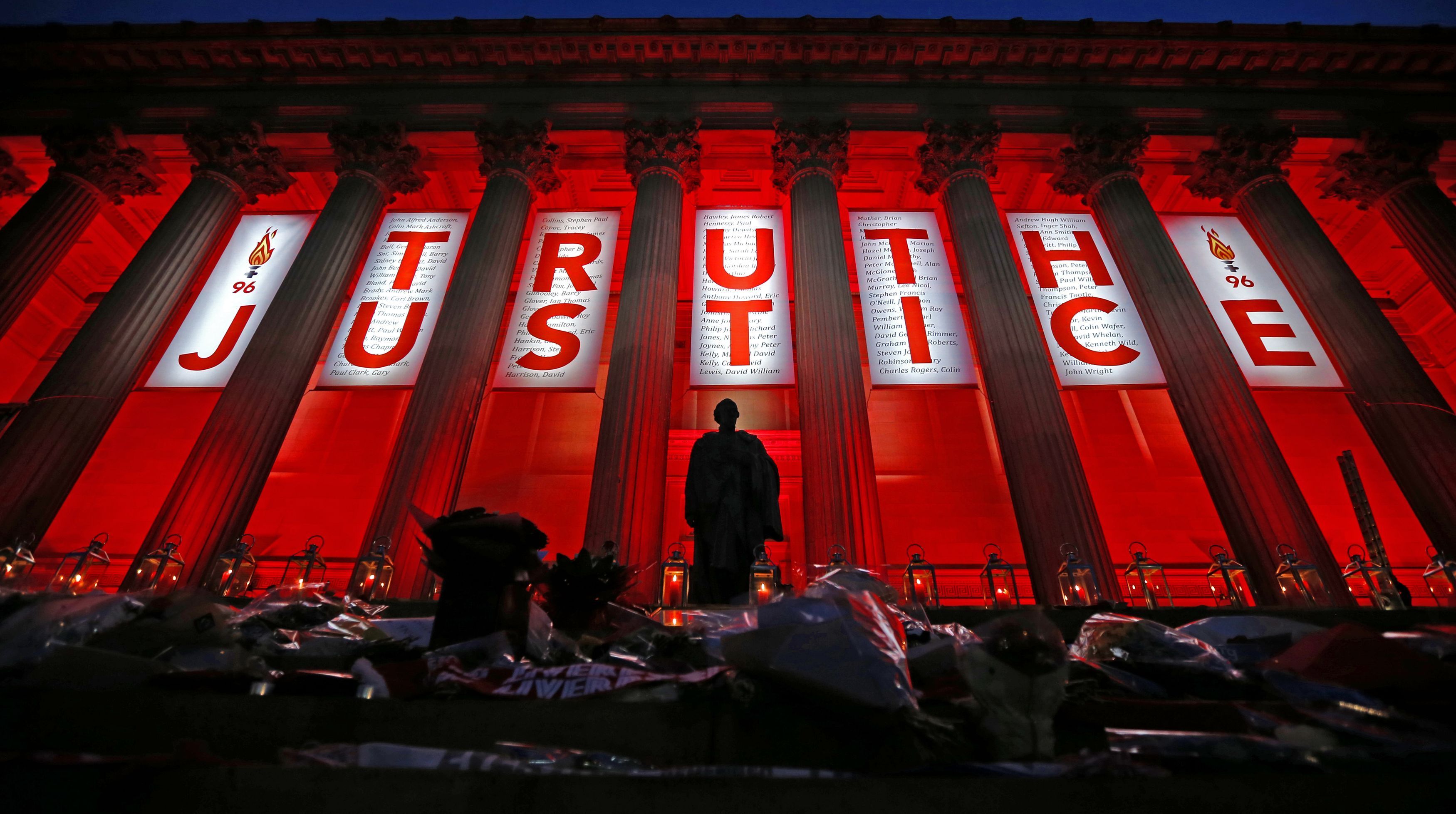 St George's Hall in Liverpool is illuminated following a special commemorative service to mark the outcome of the Hillsborough inquest, which ruled that 96 Liverpool fans who died as a result of the Hillsborough disaster were unlawfully killed.
