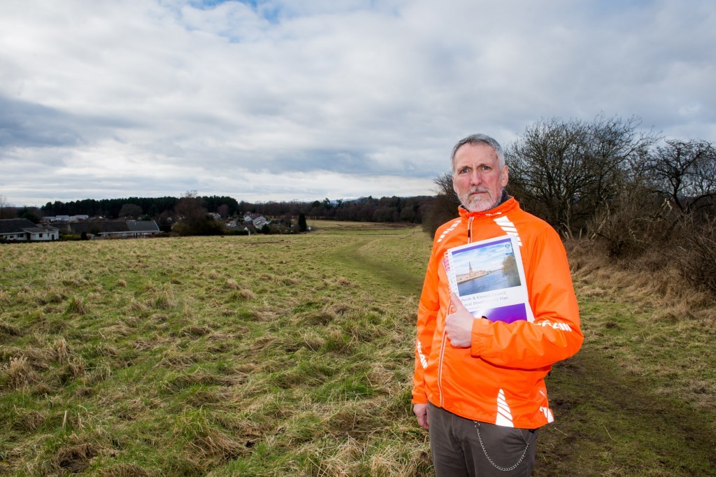 picture by fraser band 07984 163 256 fraserband.co.uk *NO PHOTO CREDIT PLEASE* Local councillor and postmaster Lewis Simpson is urging people to attend a public meeting over massive new housing plan in Scone. Lewis is pictured on the edge of the village overlooking the earmarked site.