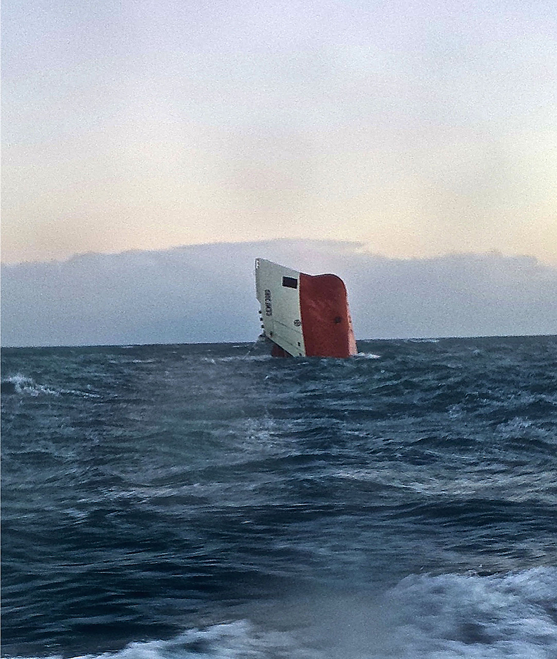 The Cemfjord cargo ship  overturned off the north coast of Scotland.