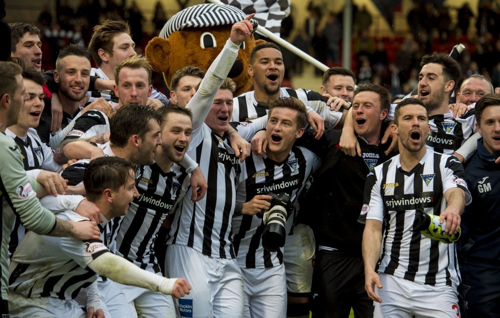 Dunfermline players celebrate winning the League One title.