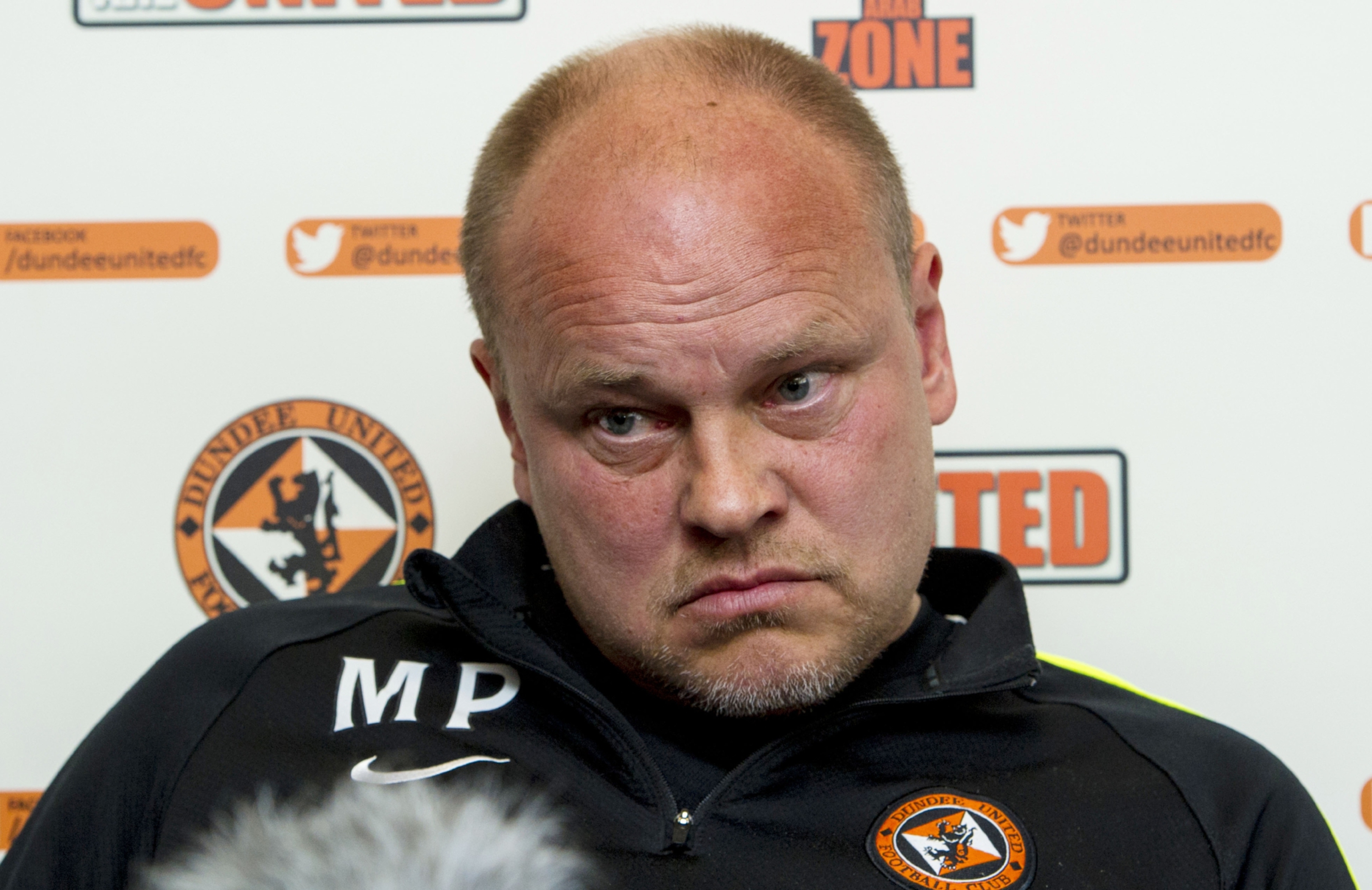 Mixu Paatelainen addresses the media at St Andrews.