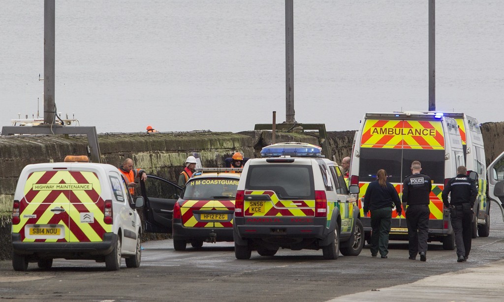 Ambulance personnel and police at the pier in South Queensferry.