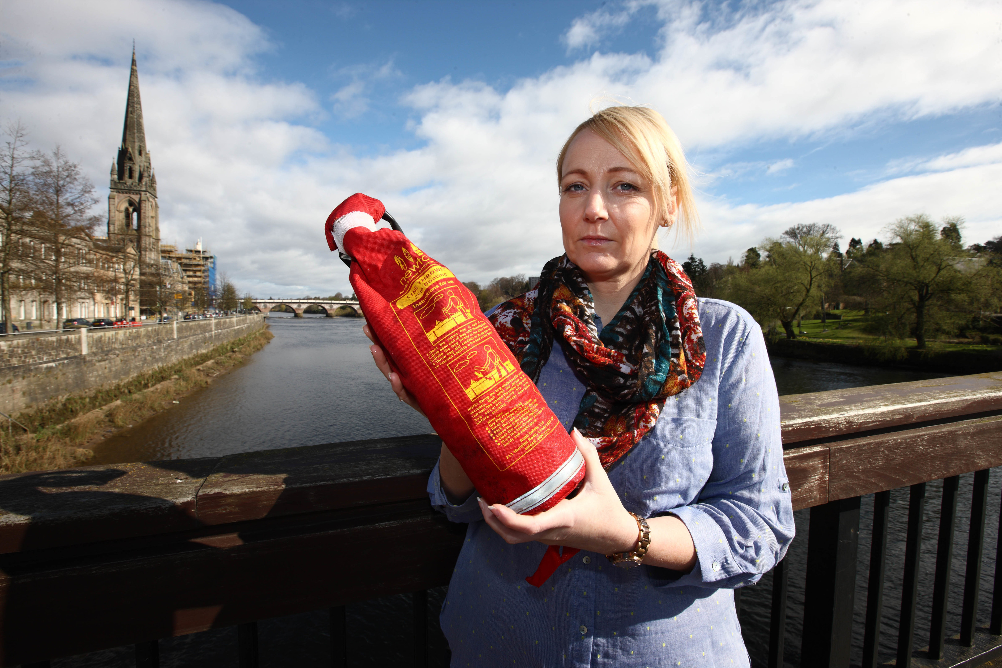 Lisa Stuart of Safe-Tay at the Queen’s Bridge in Perth with one of the vandalised throwlines.