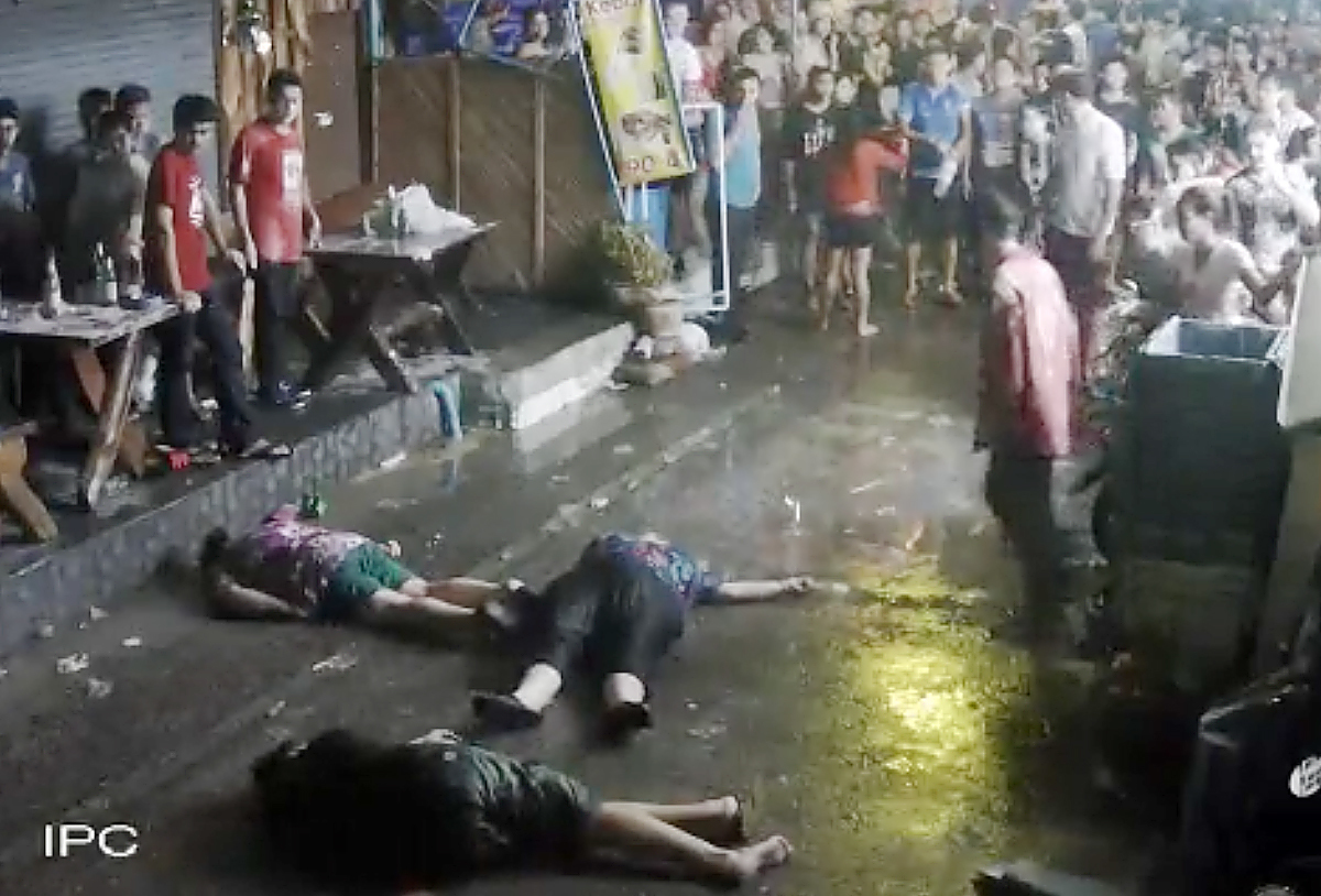 The elderly British couple and their son  on the ground after they were savagely attacked during a family vacation in Hua, Hin, Thailand.