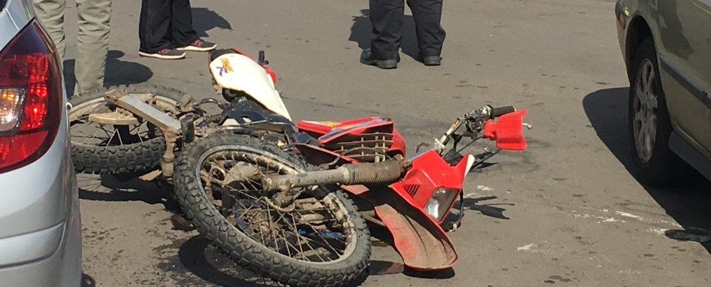 The damaged bike lies on the street after the collision