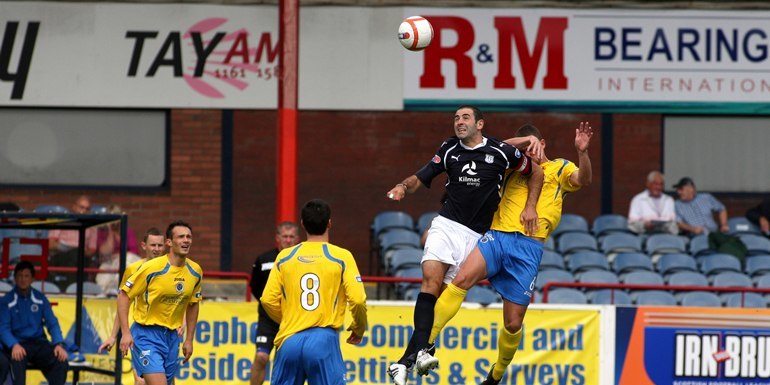 Steve MacDougall, Courier, Dens Park, Dens Road, Dundee. First game of the season. Dundee FC v Queen of the South FC. Action from the match. Pictured, Gary Harkins (Dundee) gets above Stephen McKenna (QoS).