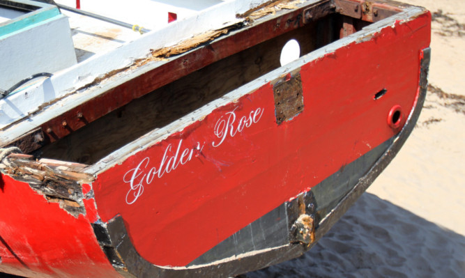 The damaged Golden Rose on the East Sands at St Andrews.