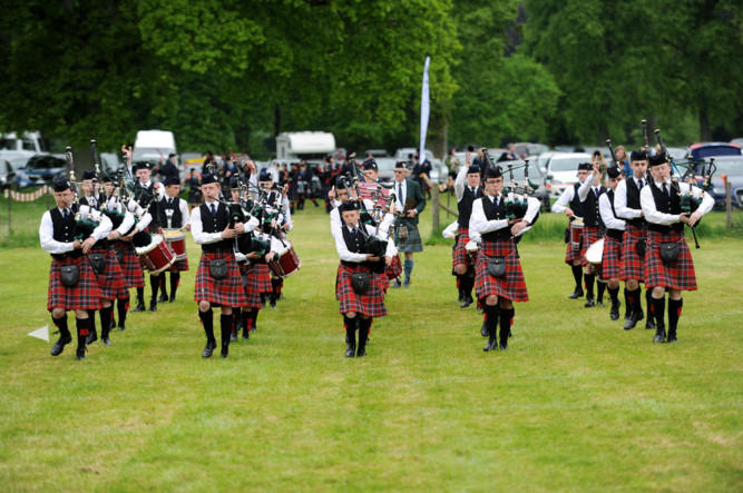 Glamis Castle hosted the Strathmore Highland Games on June 9, with dry weather helping to boost visitor numbers. The former Forfar event was renamed Strathmore Games after its move to the spectacular setting of the castle grounds. The 6th and 8th Dundee Boys Brigade Pipe Band march into the arena.