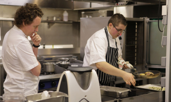 Mentor Tom Kitchin keeps a close eye on Jamie in the kitchen.