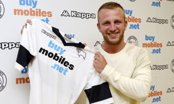 Johnny Russell with a Derby top after signing his four-year deal.