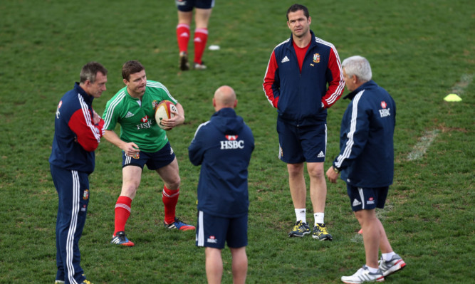 Captain Brian O'Driscoll with coaches Rob Howley, Andy Farrell and Warren Gatland during a training session.