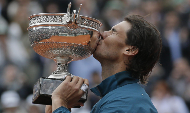 Rafael Nadal with his eighth French Open title after defeating fellow Spaniard David Ferrer.