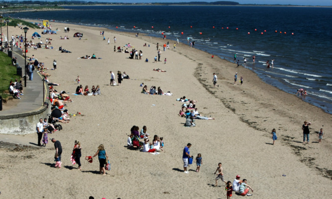 People enjoying some rare sunshine at Broughty Ferry at the weekend.