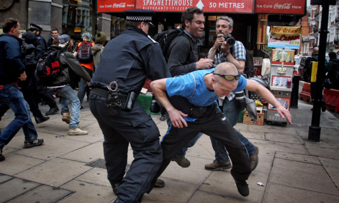 Protesters clash with police in Golden Square.