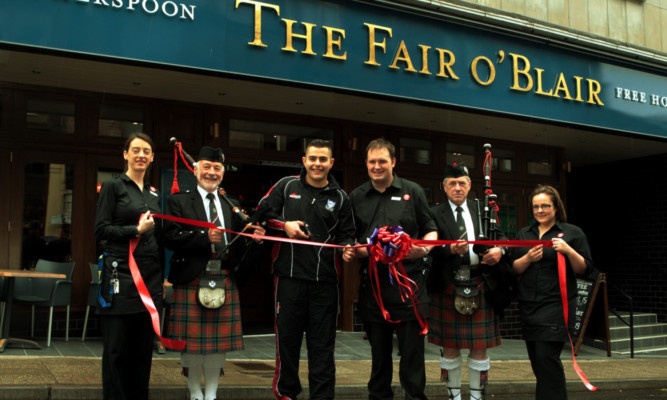 From left: staff member Lynda Bowen; piper George Carfrae; Liam McLaren, Blairgowrie FP and Scotland Students rugby player; manager Ranald Duncan; piper Andrew Durward;  and staff member Anna Fatt.