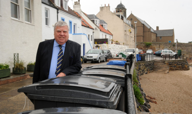 Cllr George Kay with some of the bins in Kinghorn.