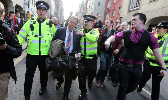 Nigel Farage had to be escorted by police officers while leaving the Cannons Gait pub in Edinburgh during his last visit.